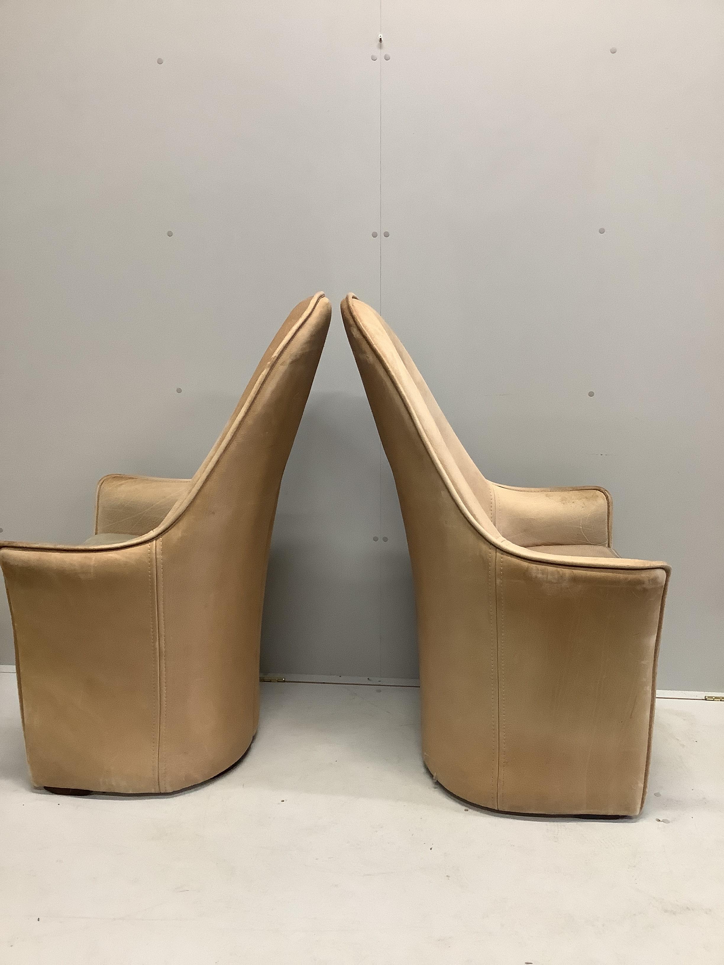 A pair of mid century leather high back armchairs, width 64cm, depth 65cm, height 118cm